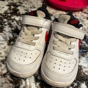 Nike Kids White Sneakers with Red Swoosh and Black Details